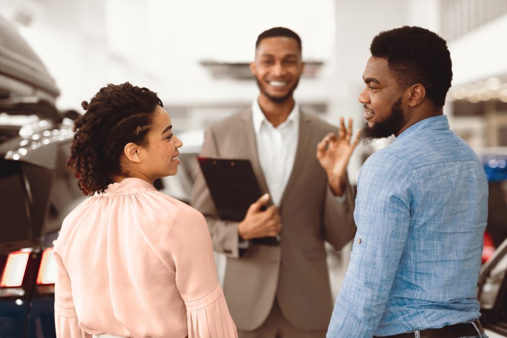 A salesperson having face-to-face marketing session with his customers.